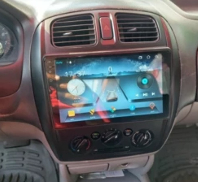 مانیتور اندروید ۱۱ اینچ برای مزدا ۳۲۳ کامل باقاب ودوربین دنده عقب خط دار رام ۴در ۶۴ در ۱در۱۶ مارک خوب هارمن